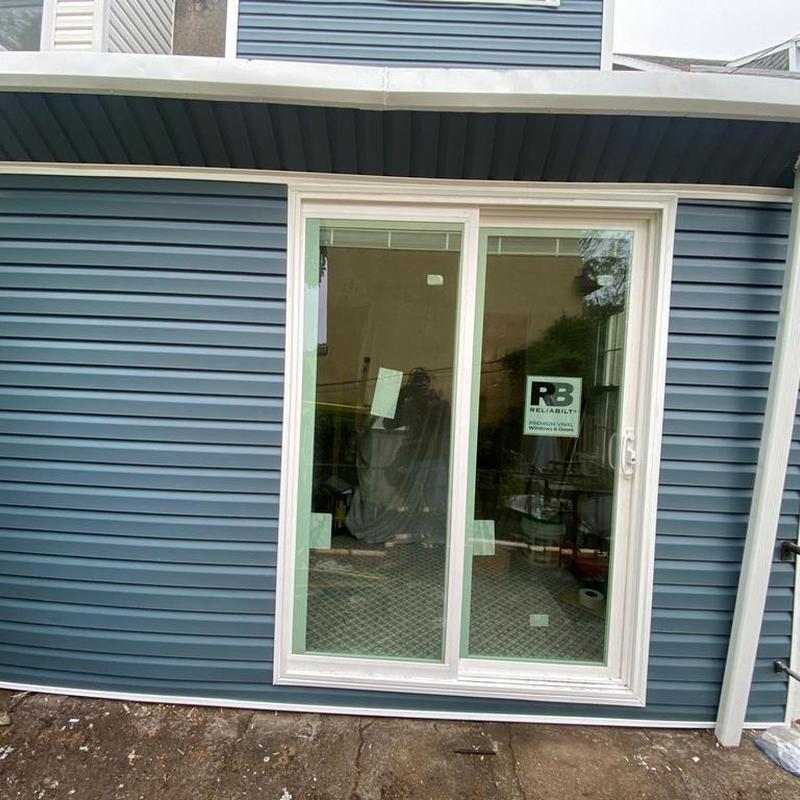 Vinyl siding and sliding glass door installation