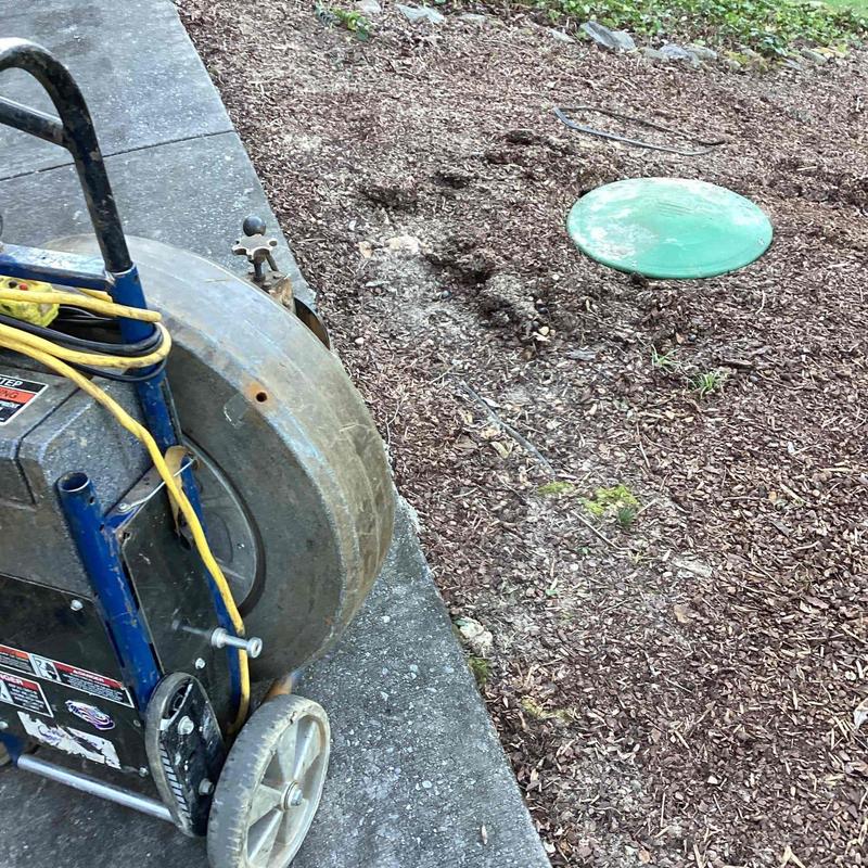 Septic tank mainline cable cleaning near house