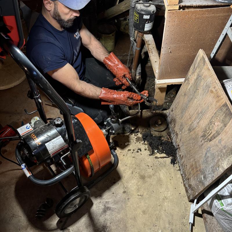 Main drain cleaning with plumber and drain machine Main drain cleaning with plumber and drain machine