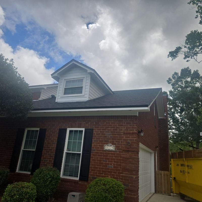 Asphalt shingle roof on brick house with dormer Asphalt shingle roof on brick house with dormer
