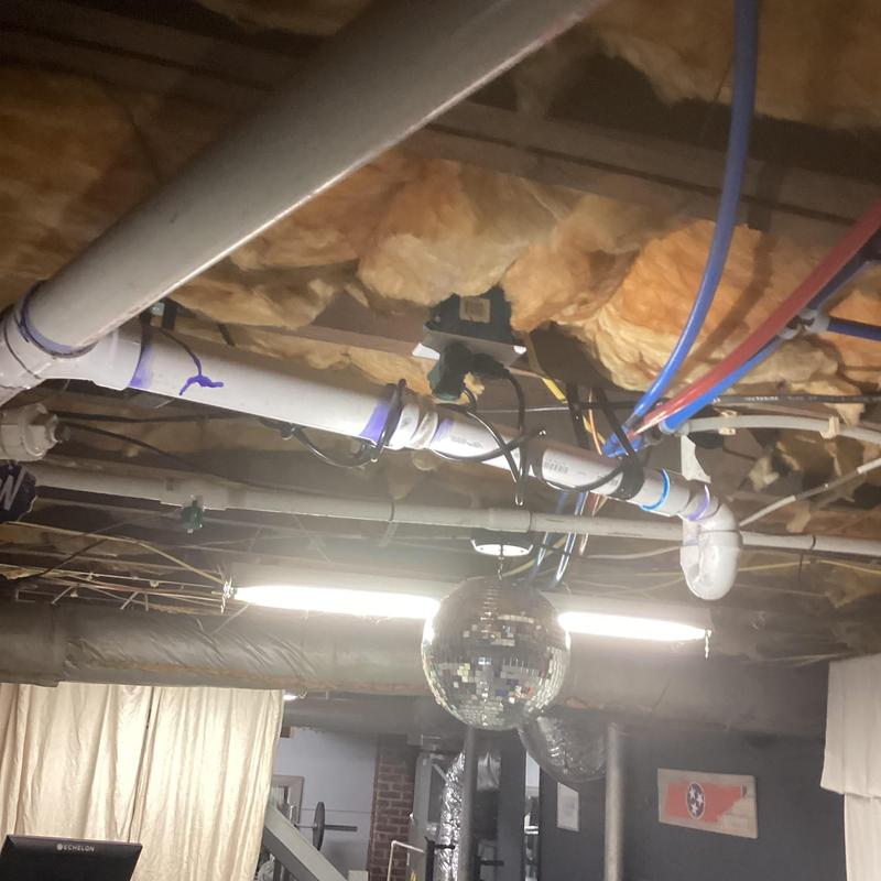 Ice maker drain line with PVC pipes and insulation