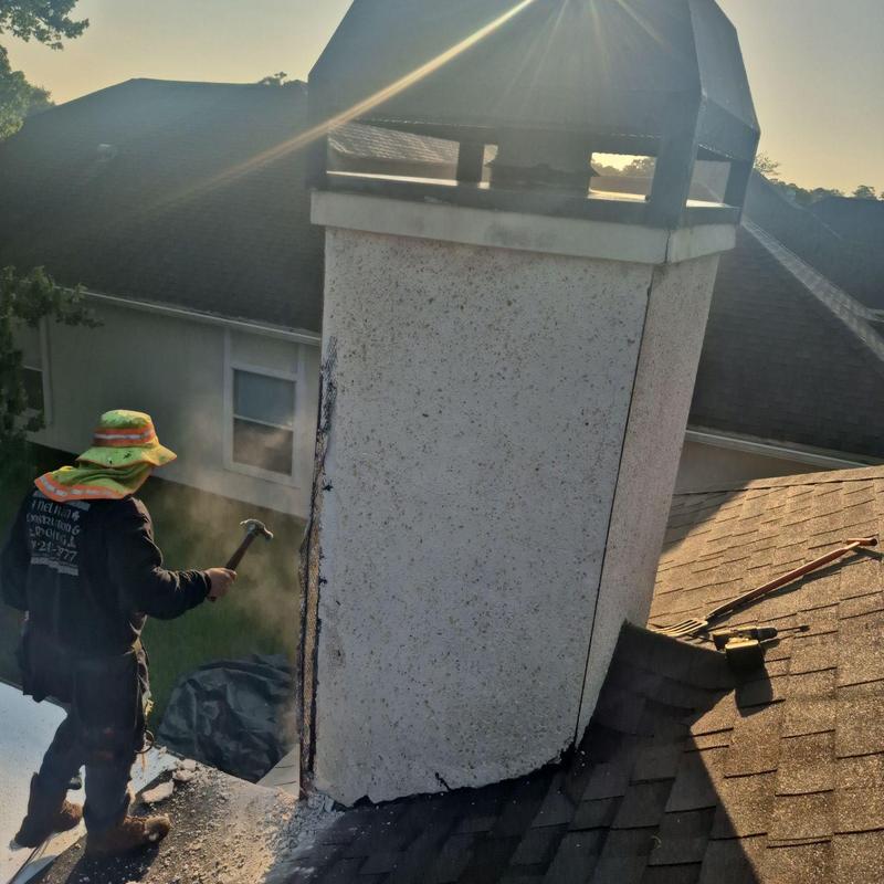 Chimney demolition on asphalt shingle roof Chimney demolition on asphalt shingle roof
