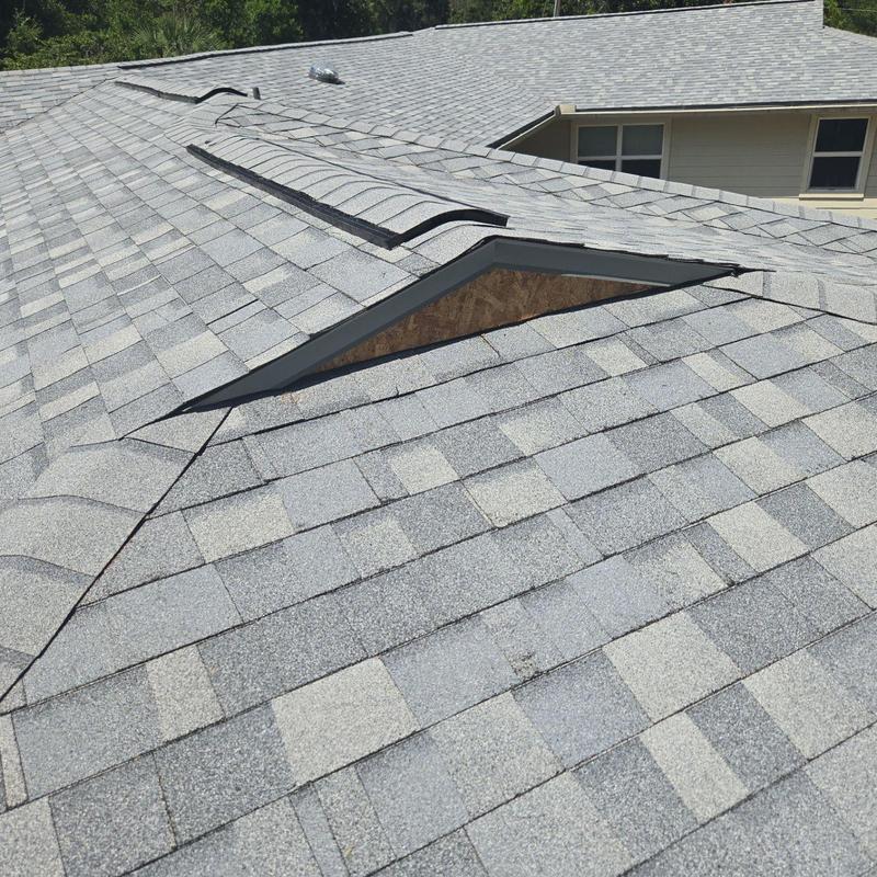 Roof shingles with vent installation on residential roof Roof shingles with vent installation on residential roof