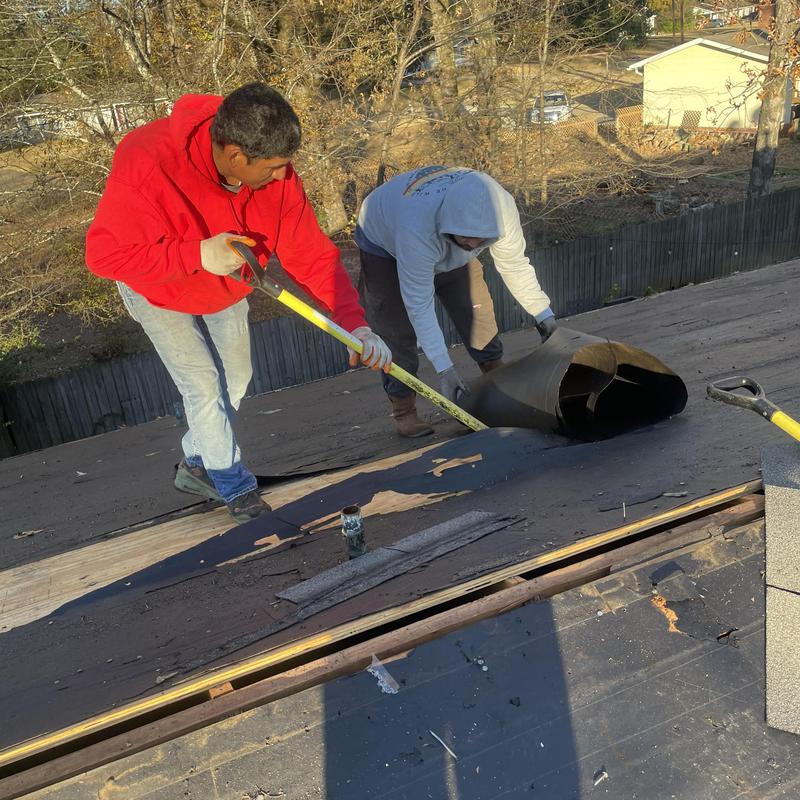 Roofing felt removal during roof installation in Florence, MS