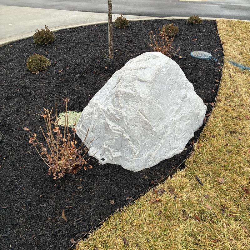 Irrigation backflow preventer with faux rock cover