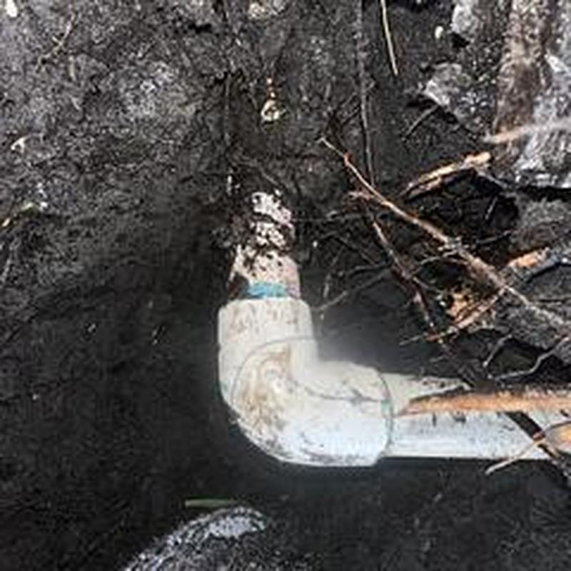 Corroded PVC drain pipe joint buried in soil repair