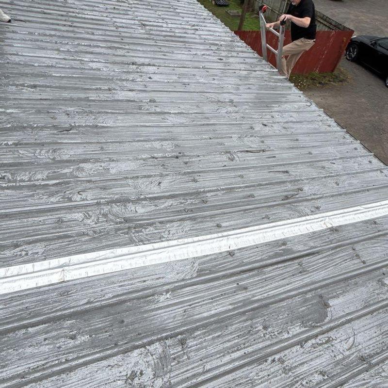 Metal roofing with hail damage during inspection