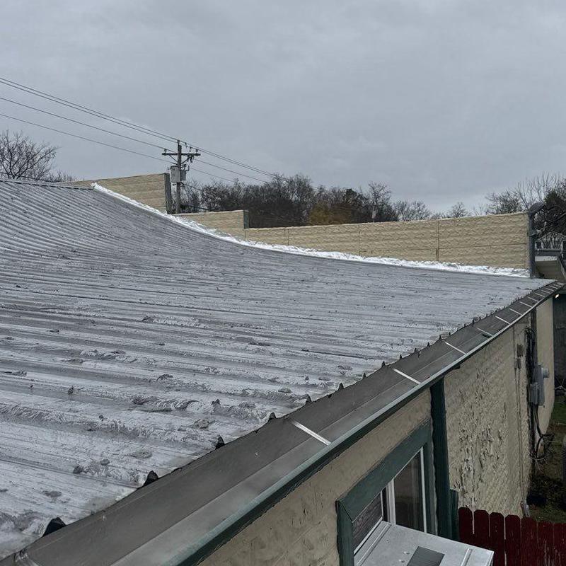 Metal roof with hail damage and drainage evaluation