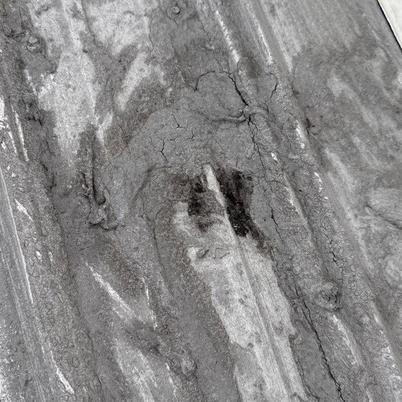 Commercial roofing membrane with hail damage and cracking