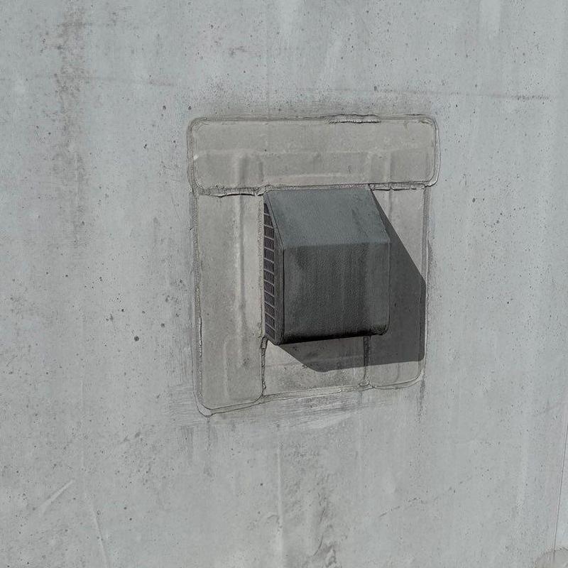 Roof vent flashing with sealant on concrete surface