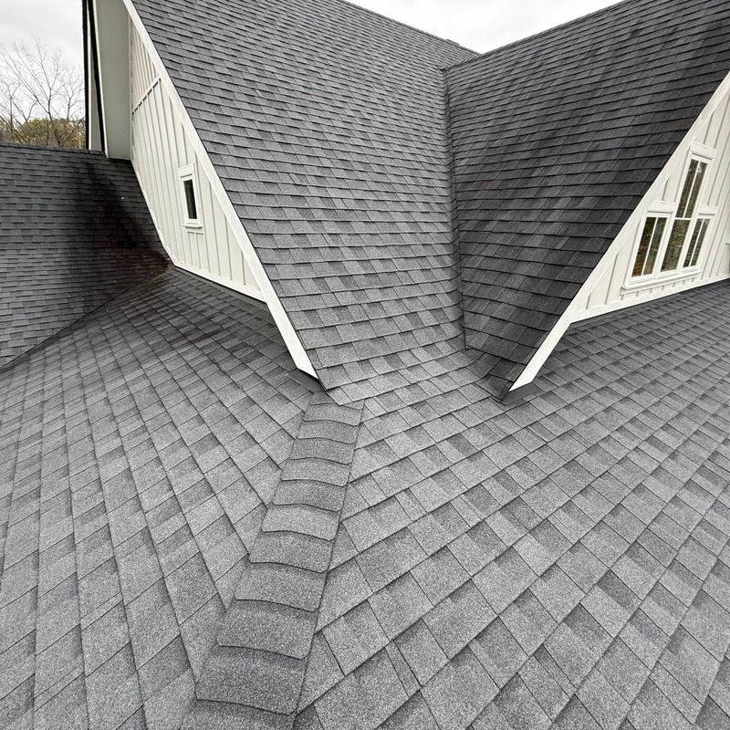 Asphalt shingle roof with ridge caps and valleys