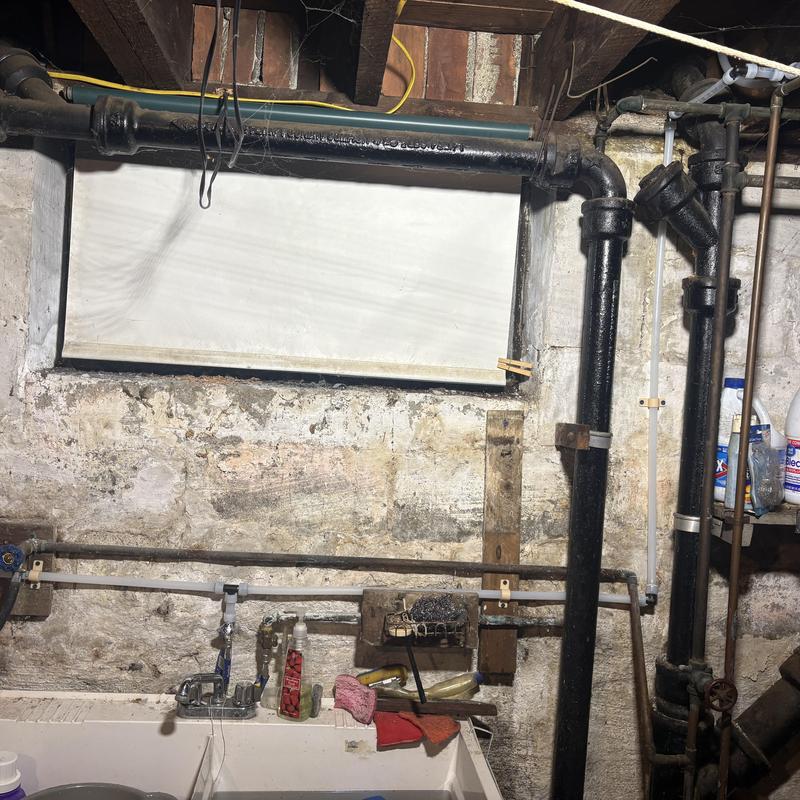 Old cast iron drain and replaced PEX water lines in basement Old cast iron drain and replaced PEX water lines in basement