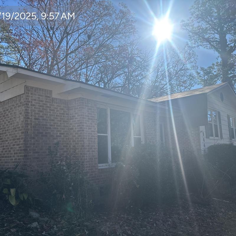 Roof with Owens Corning Supreme Autumn Brown shingles in sunlight Roof with Owens Corning Supreme Autumn Brown shingles in sunlight