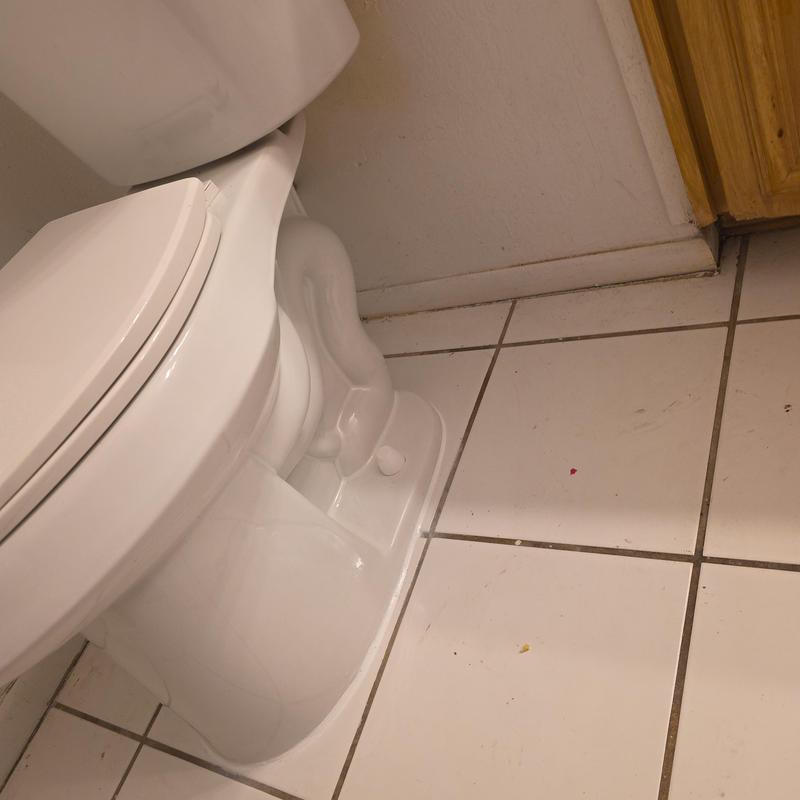 Cast iron closet flange and toilet installation on tile floor