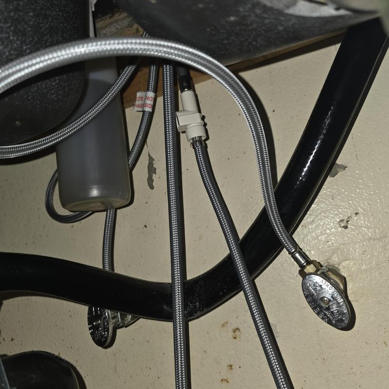 Kitchen faucet waterlines and shutoff valves under sink
