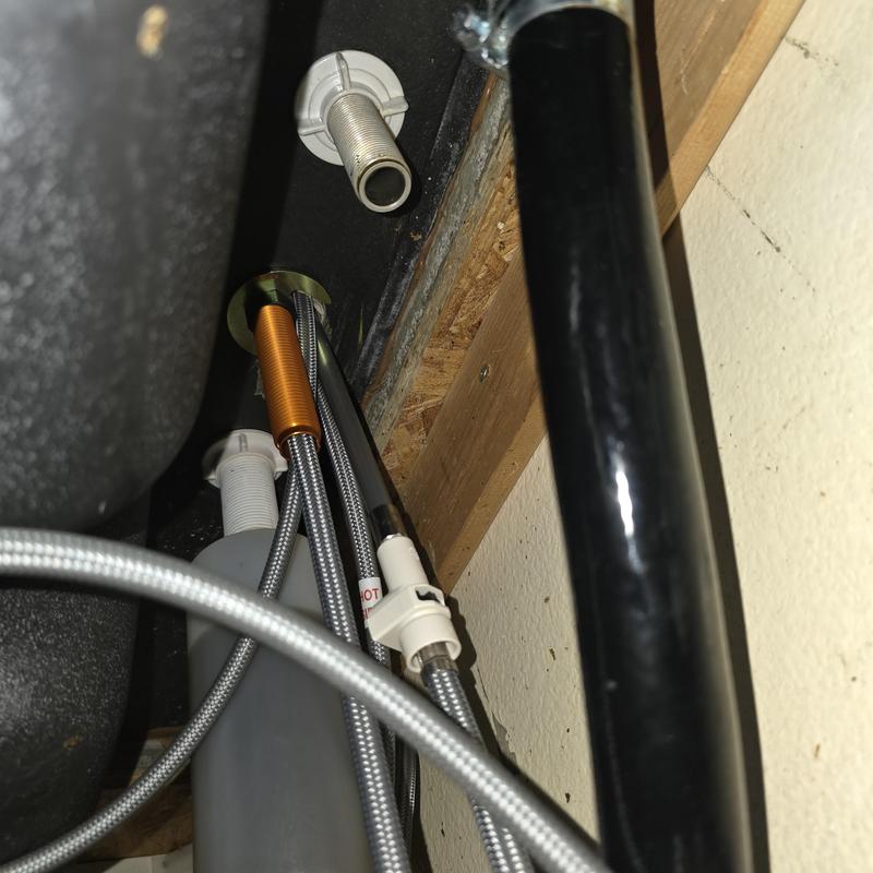 Kitchen faucet waterlines and supply connections under sink