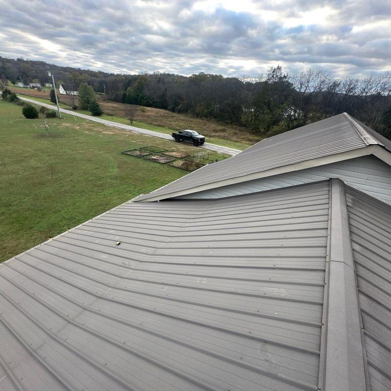 Metal roof panels with hail impact damage overview