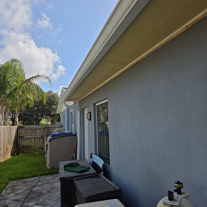 Fiber cement soffit panels installation on house exterior Fiber cement soffit panels installation on house exterior