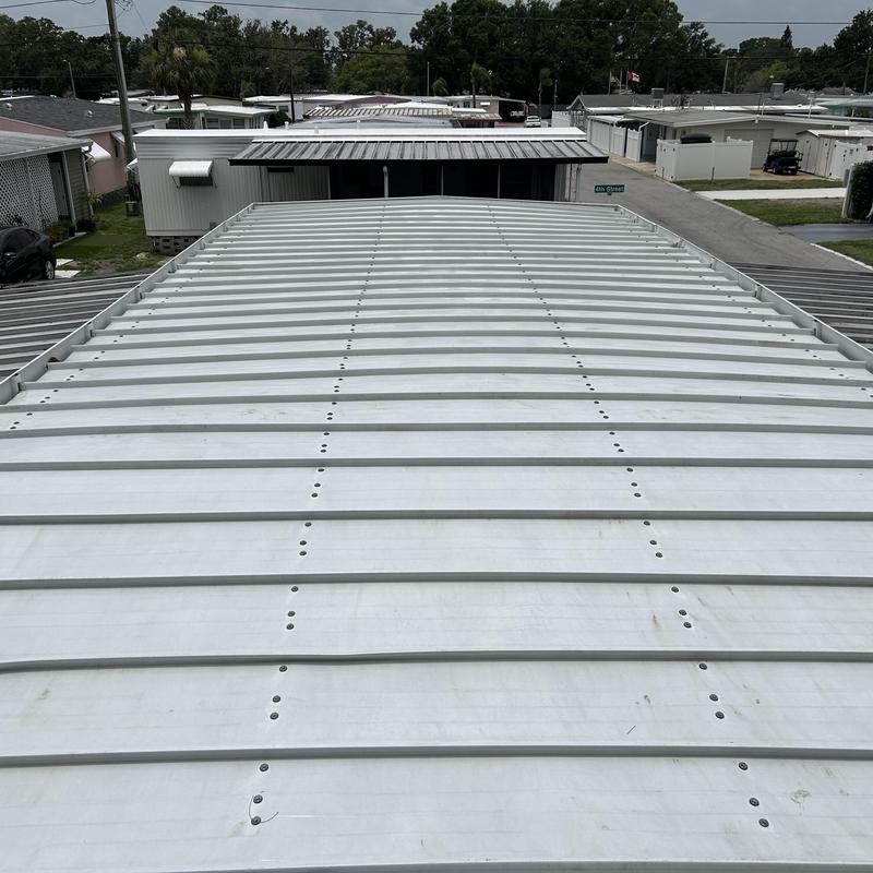 Metal roof cleaning and flashing repairs in Tampa FL