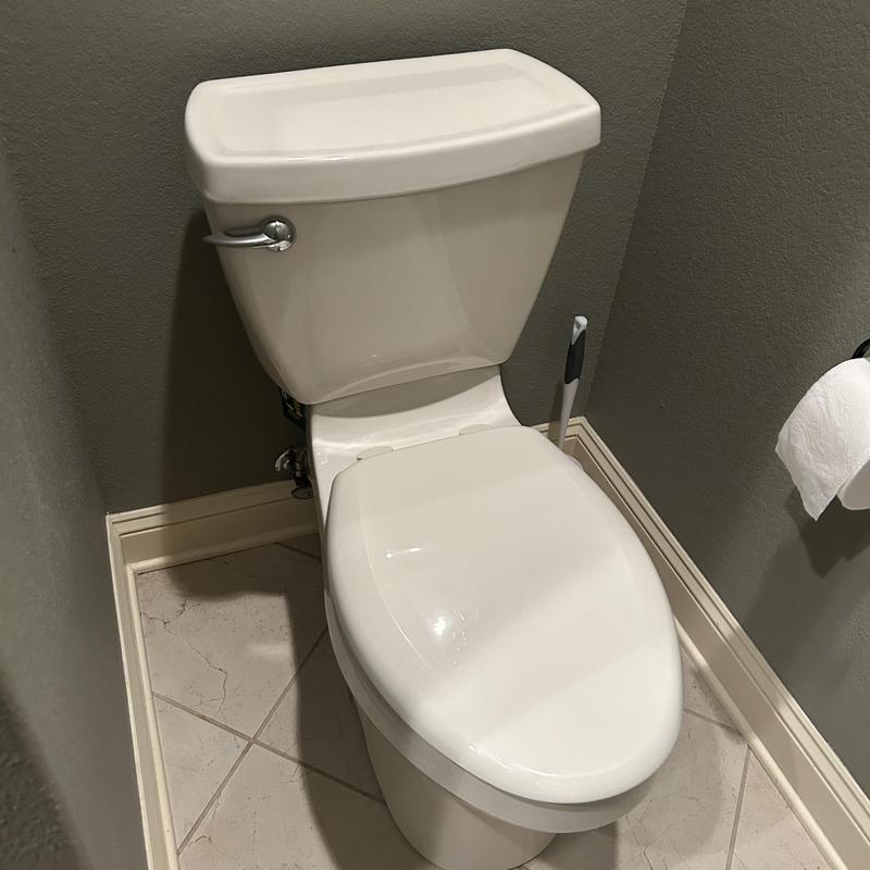 Comfort height toilet replacement in bathroom corner