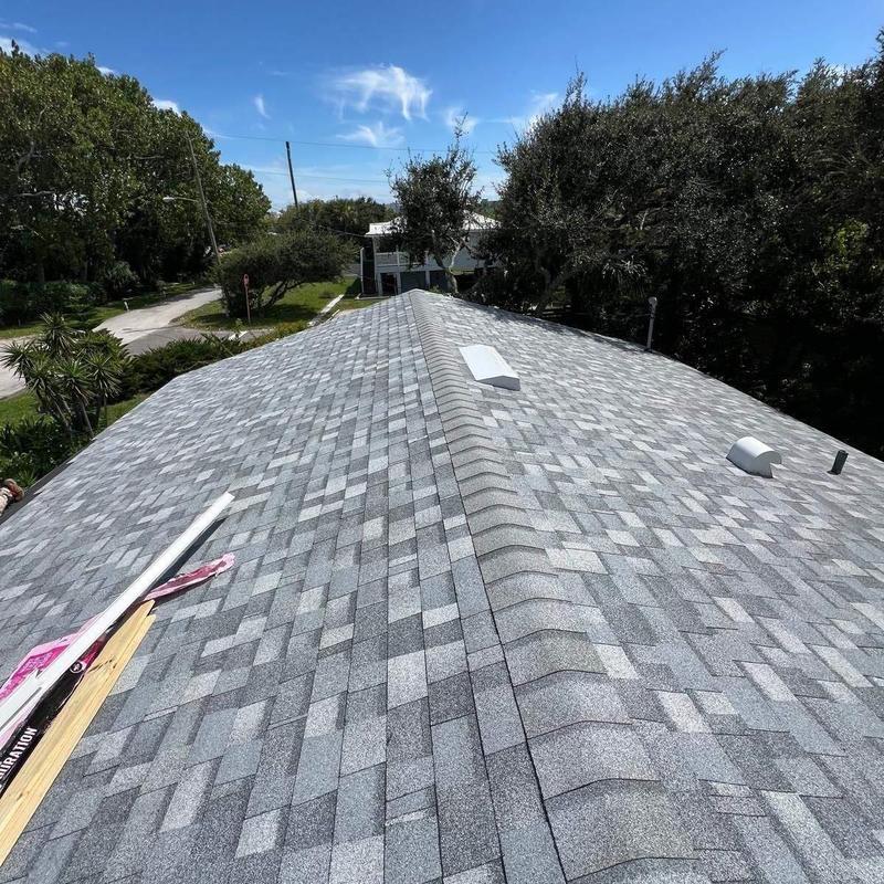 Asphalt shingle roof installation with ridge vents Asphalt shingle roof installation with ridge vents