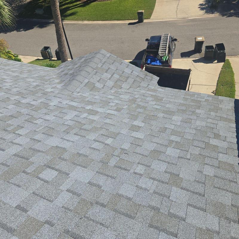 Asphalt shingle roof installation on residential home Asphalt shingle roof installation on residential home
