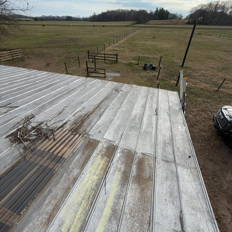 Metal roof panels with corrosion and debris buildup