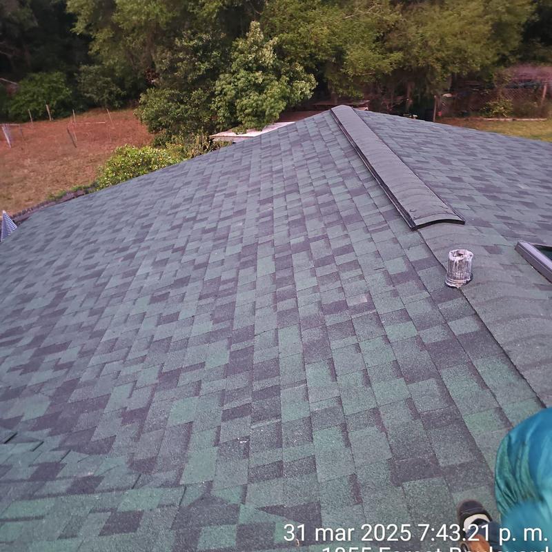 Asphalt shingle roof with ridge vent installation Asphalt shingle roof with ridge vent installation