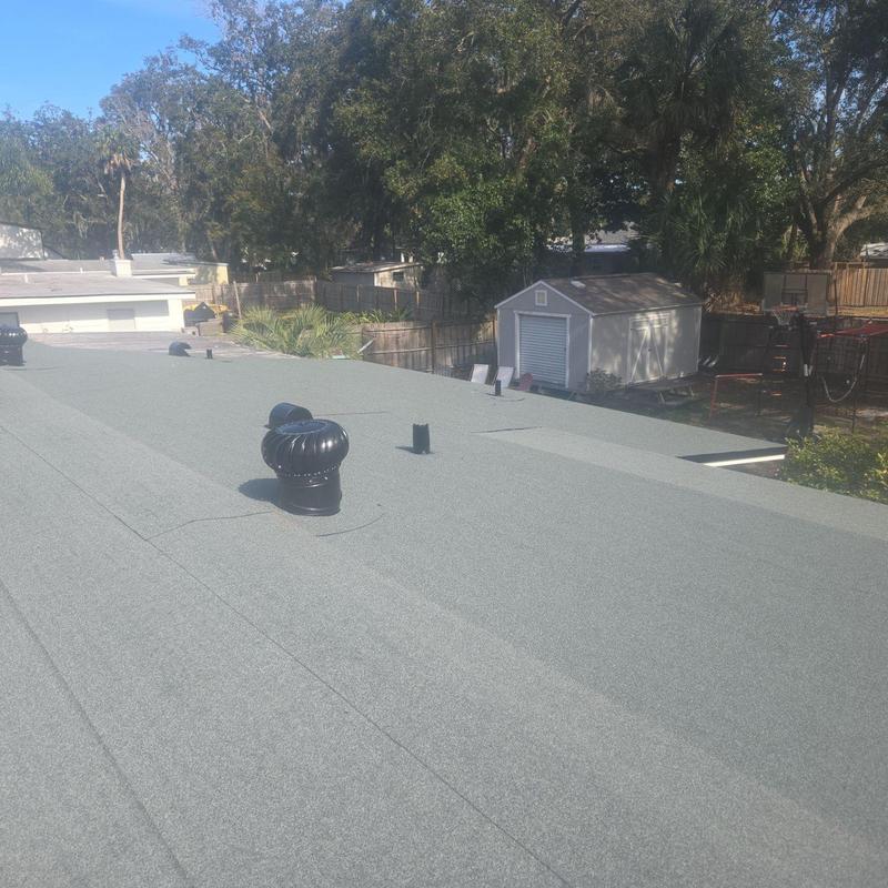 Low slope roof with ventilation turbines installation Low slope roof with ventilation turbines installation