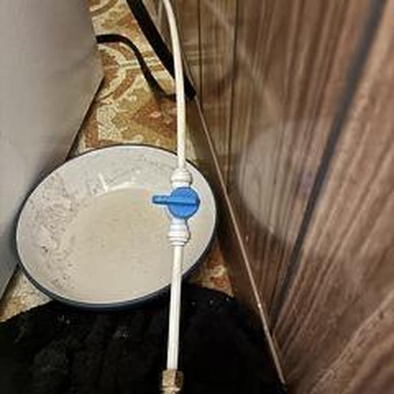 Refrigerator shut off valve with white tubing installed