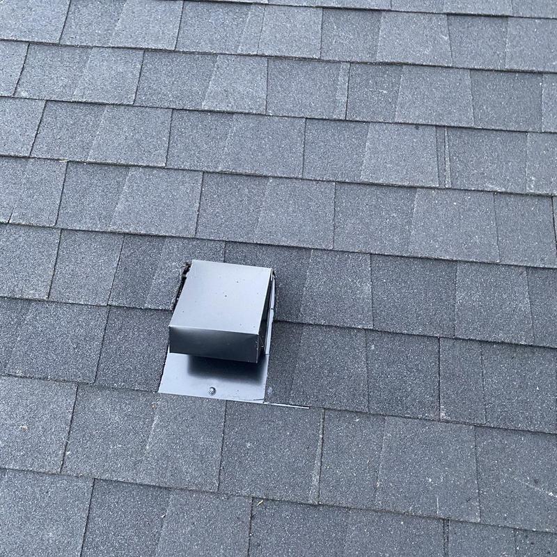 Roof exhaust vent with new flashing on shingle roof