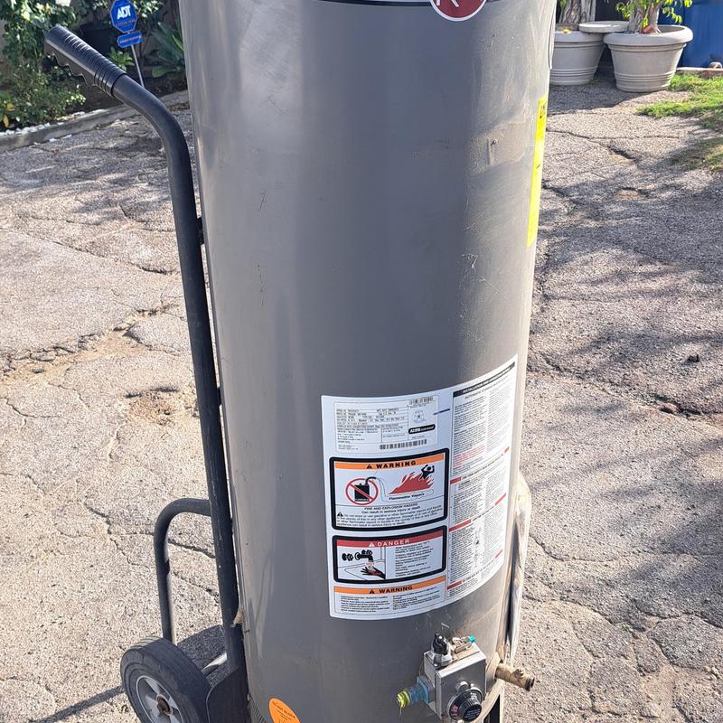 Gas water heater on dolly exterior shed replacement Gas water heater on dolly exterior shed replacement