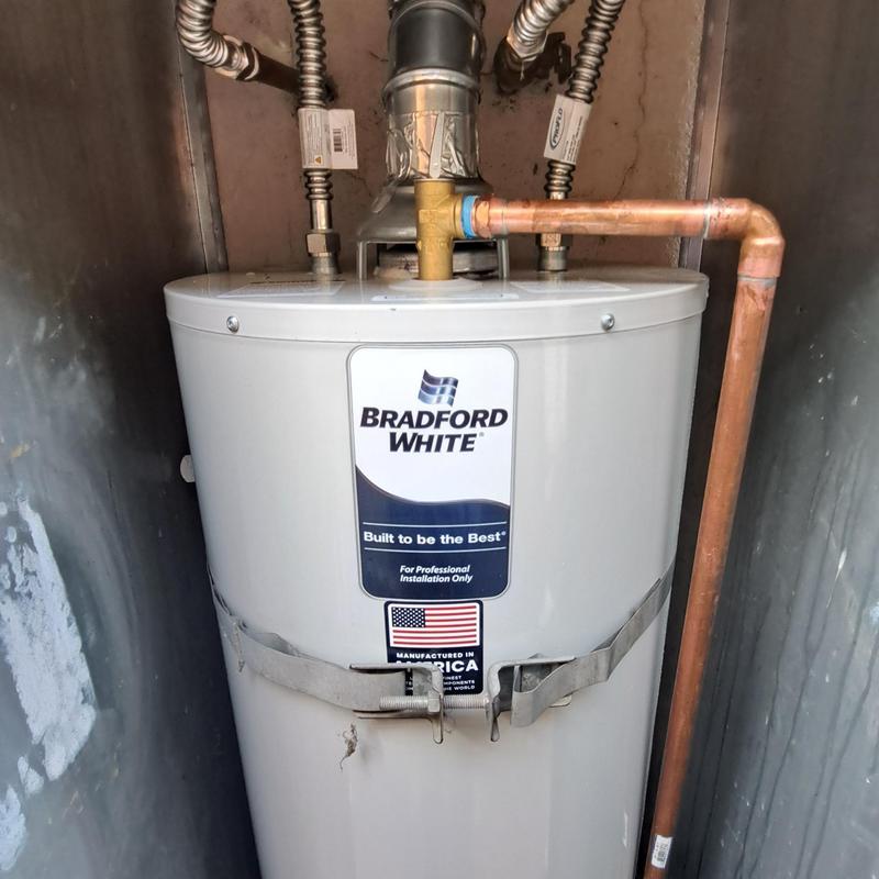 Gas water heater with copper piping in shed Gas water heater with copper piping in shed