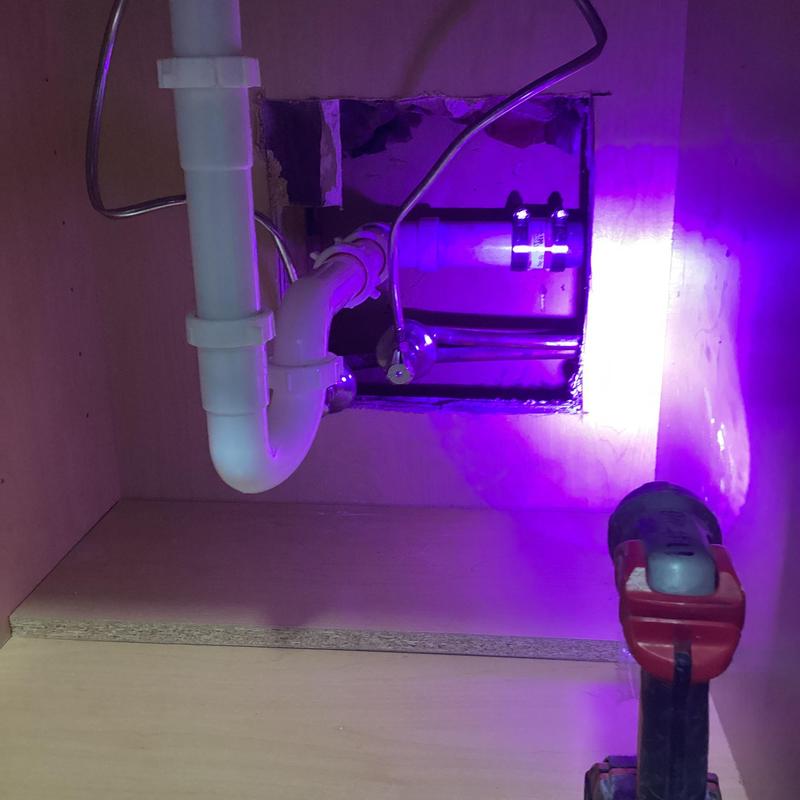 Galvanized pipe repair under break room sink