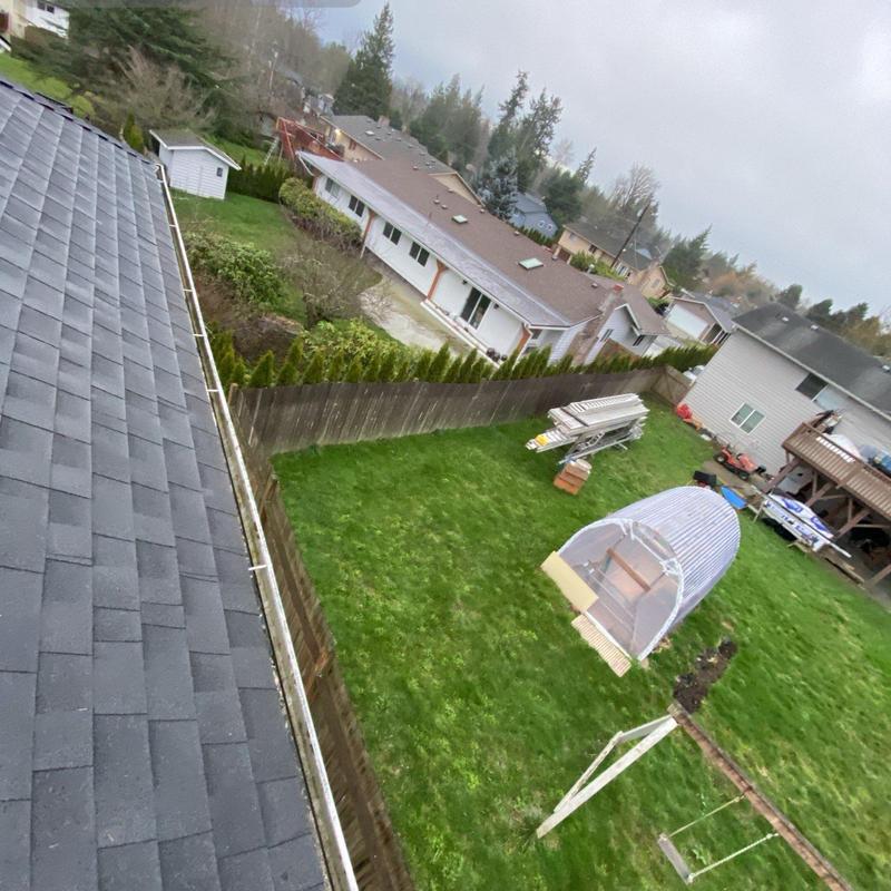 Gutter cleaning and leaf blowing on residential roof