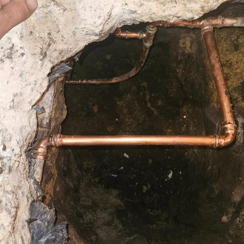Copper hot water line with slab leak repair