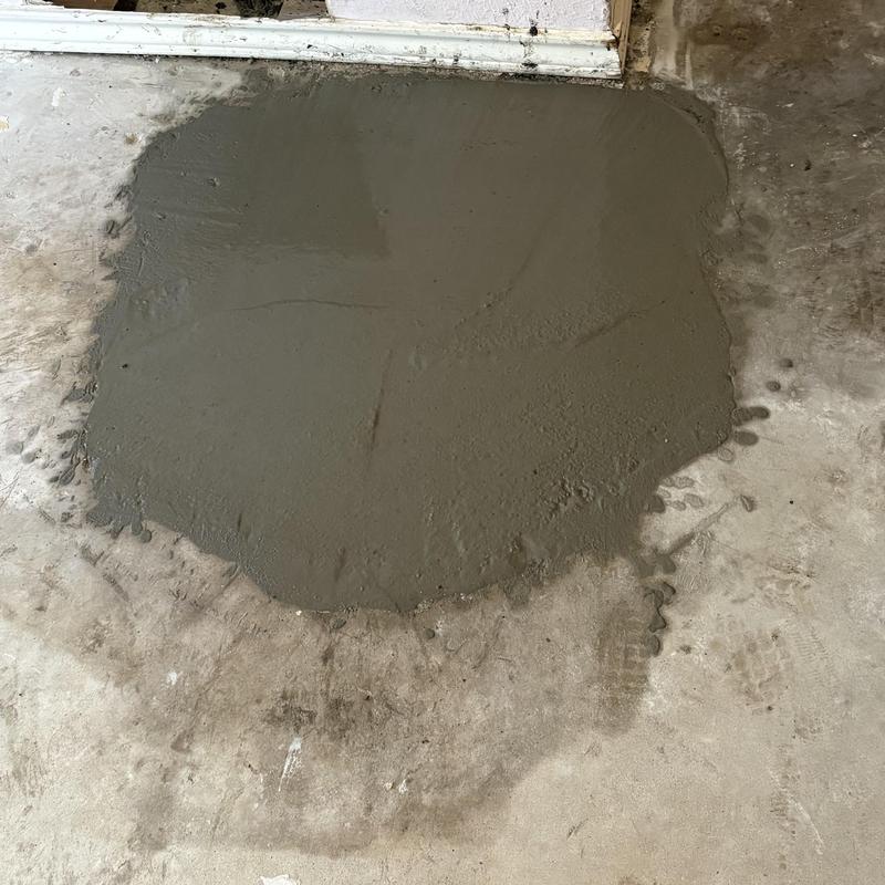 Hot water line slab leak with fresh concrete patch
