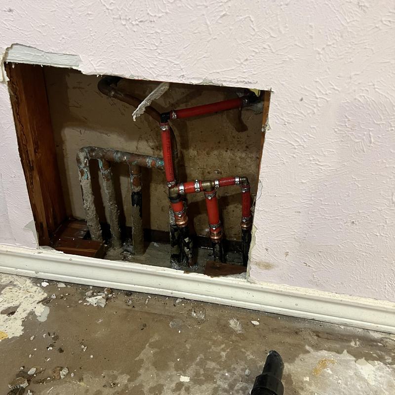 Hot water line leaks in wall and slab piping