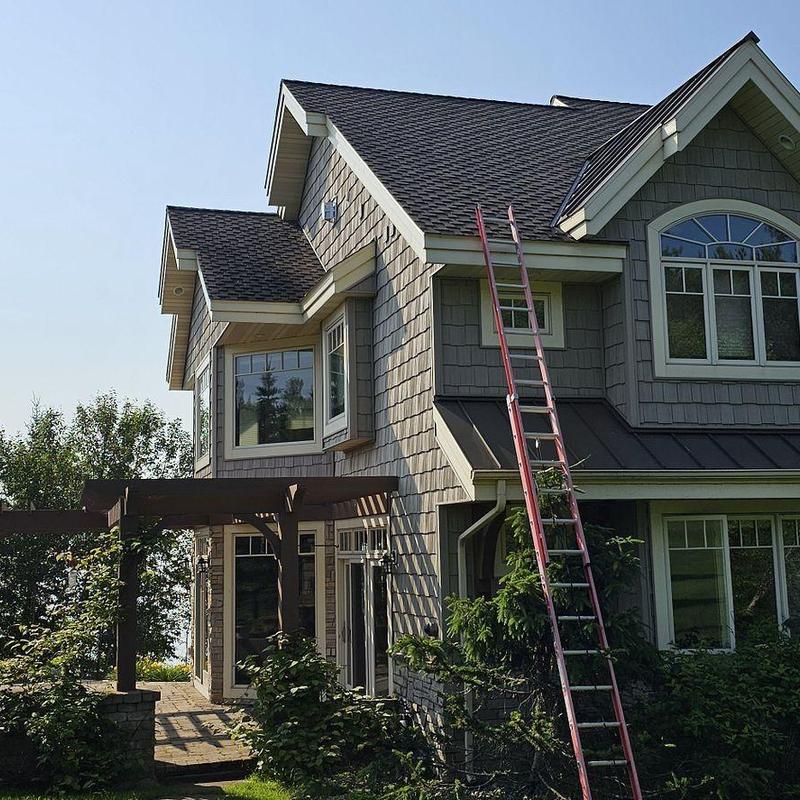 Asphalt shingle roof with ladder for repair access Asphalt shingle roof with ladder for repair access