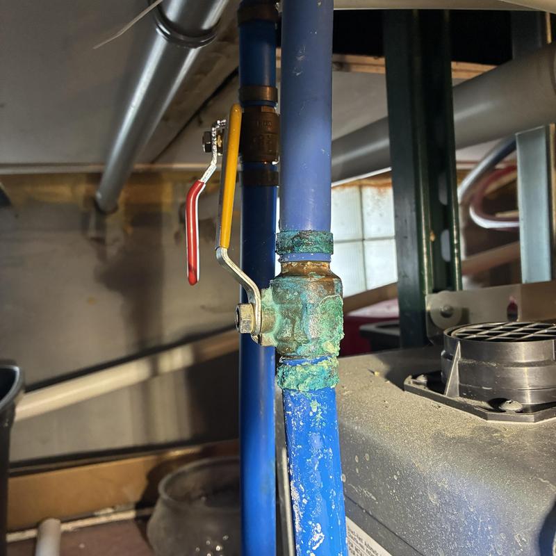 Tankless water heater valve with corrosion buildup