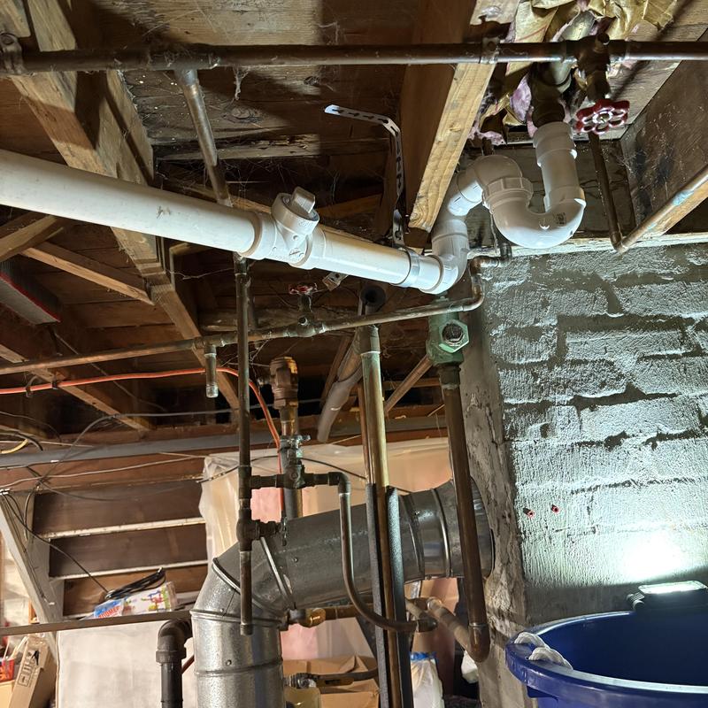 Bathroom tub PVC drain replacement under ceiling pipes