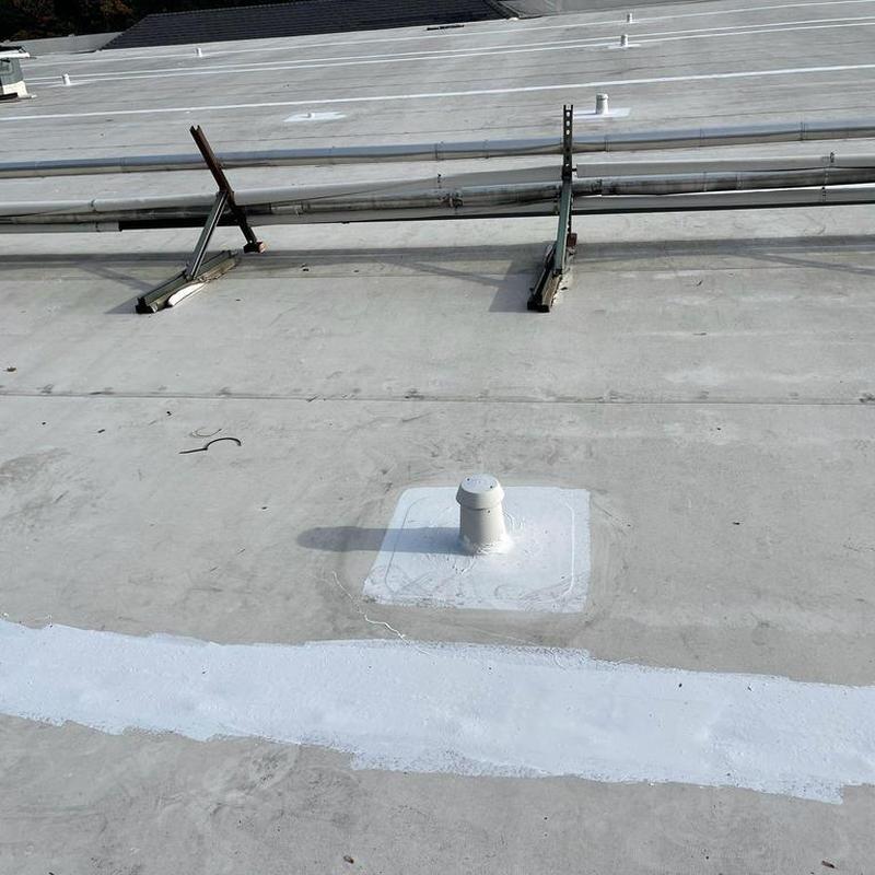 Commercial roof silicone coating with sealed vent pipe