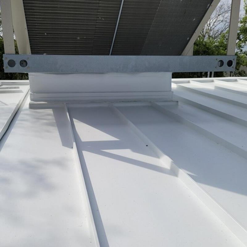 Silicone-coated metal roof panels with mounting bracket