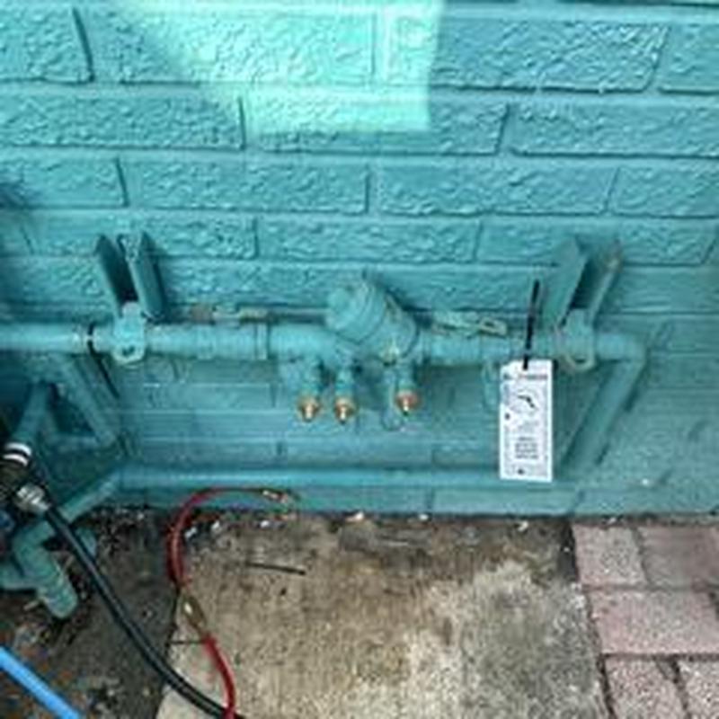 Backflow prevention device inspection with tag attached