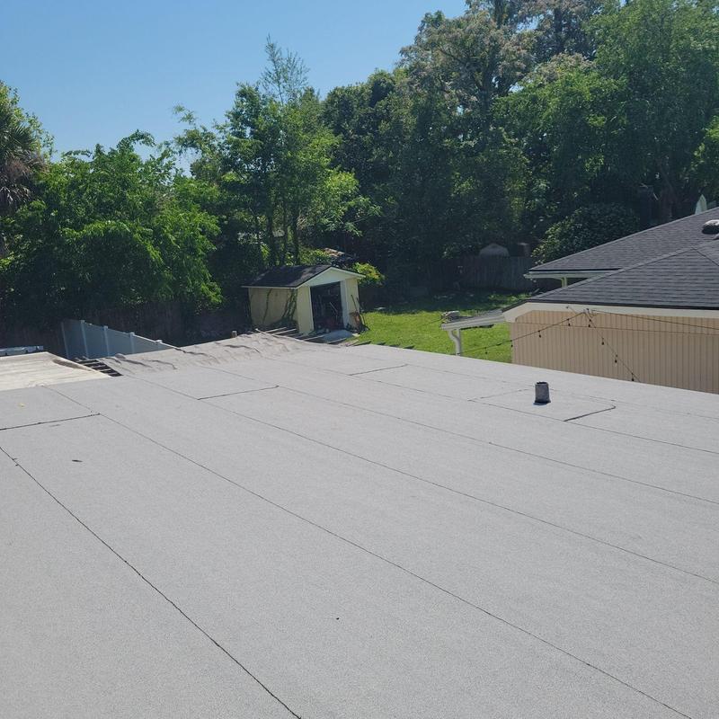Modified bitumen flat roof with vent pipe and trees Modified bitumen flat roof with vent pipe and trees