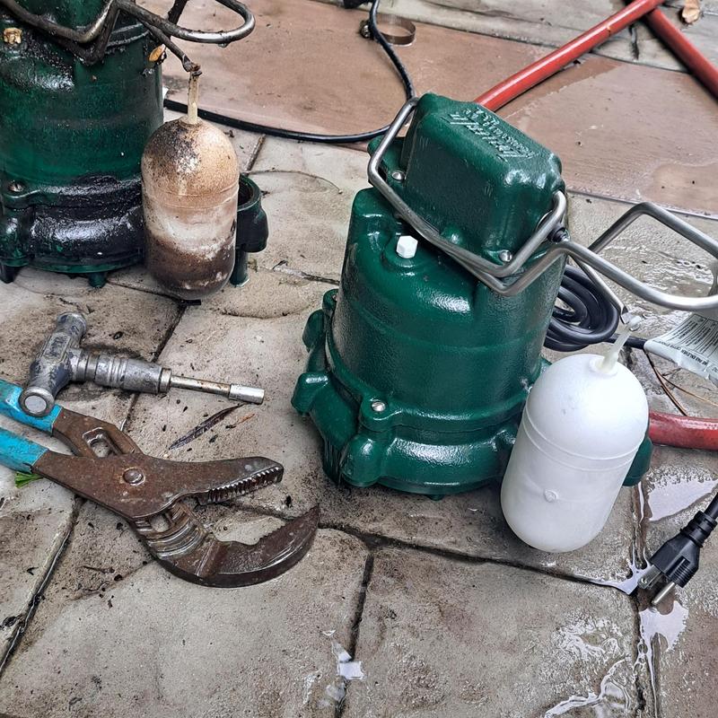 Sump pump with float switches and plumbing tools Sump pump with float switches and plumbing tools