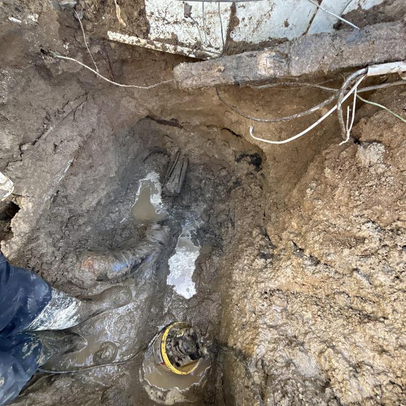 Broken underground drain pipe excavation and repair