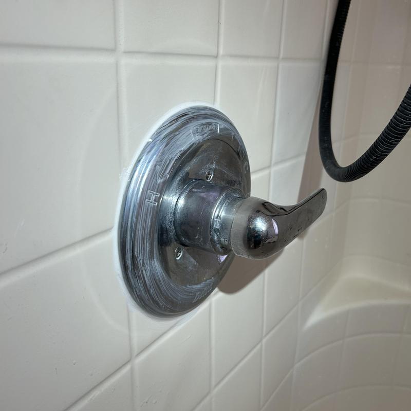 Delta shower valve handle and trim in bathroom tub