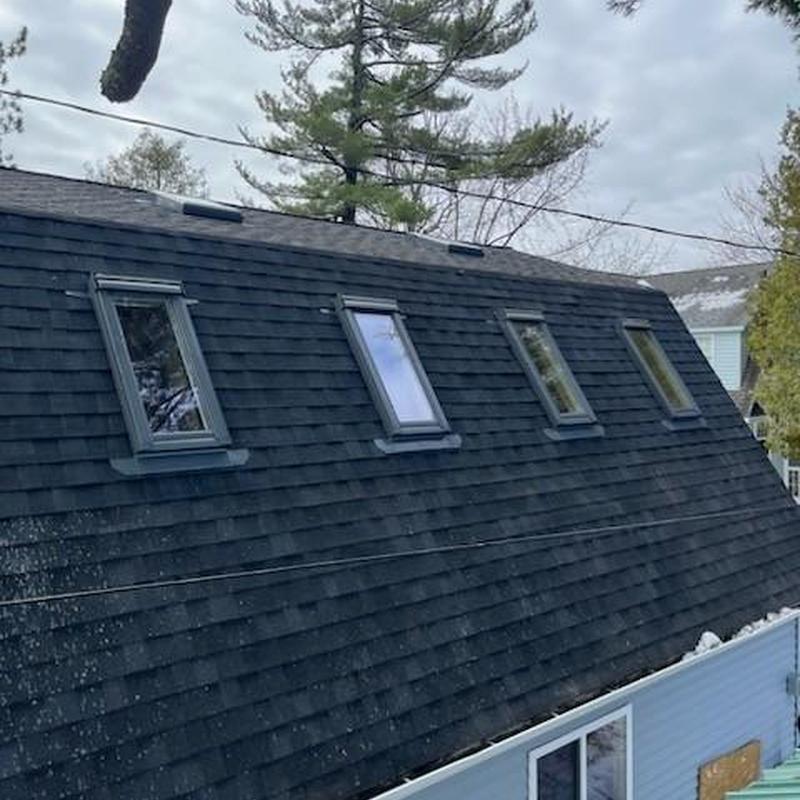 Velux operable skylights installed on black roof shingles Velux operable skylights installed on black roof shingles