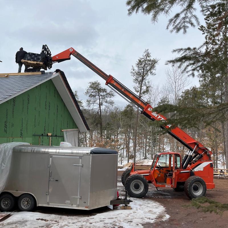 EcoStar synthetic slate roof installation with forklift lift EcoStar synthetic slate roof installation with forklift lift
